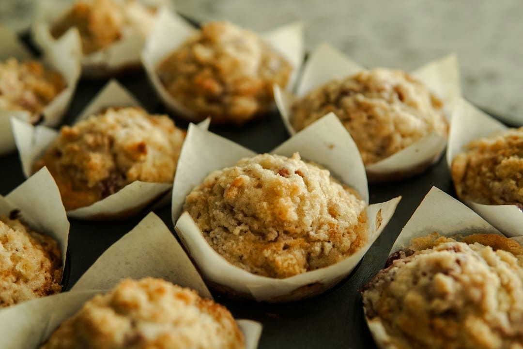 Crumb-topped muffins in paper baking cups