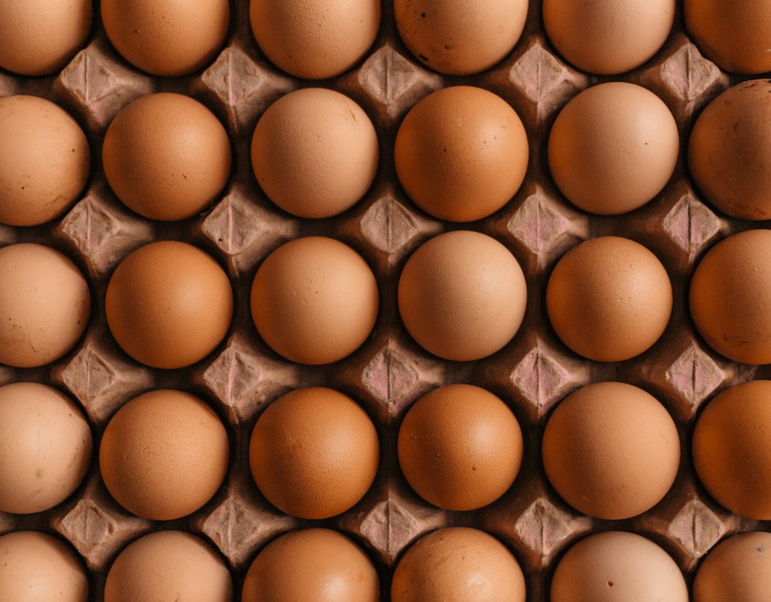 Brown eggs in a carton, an ingredient reference for sheet pan egg sandwiches