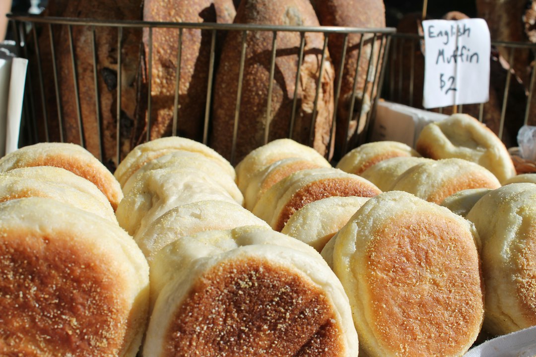 English muffins displayed in bakery baskets