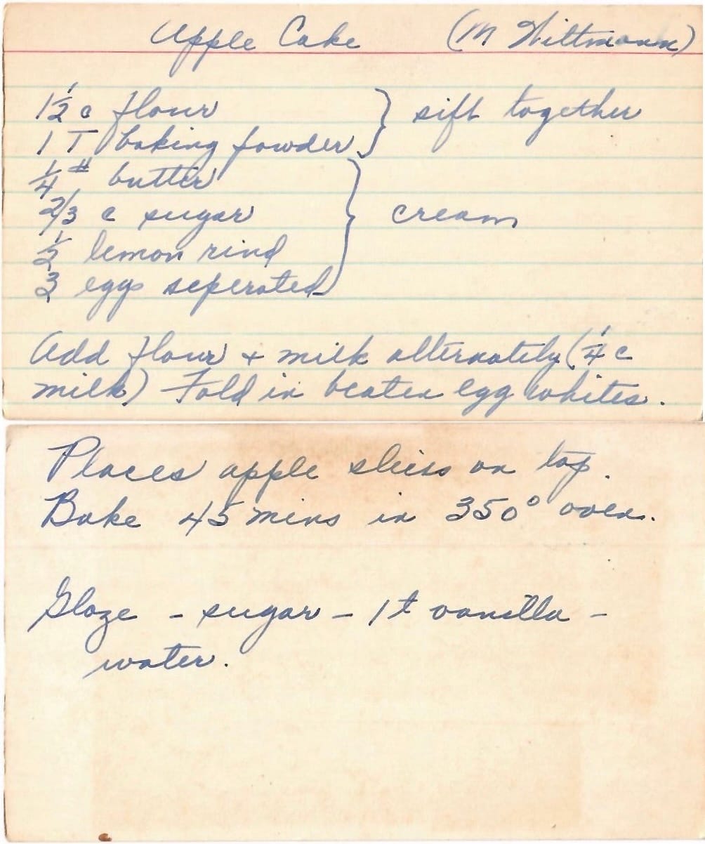 Aged handwritten apple cake recipe card with faded ink