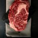 Raw marbled ribeye steak on butcher paper, an ingredient reference for air fryer steak without butter