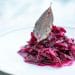Shredded red cabbage served in a small mound on a plate