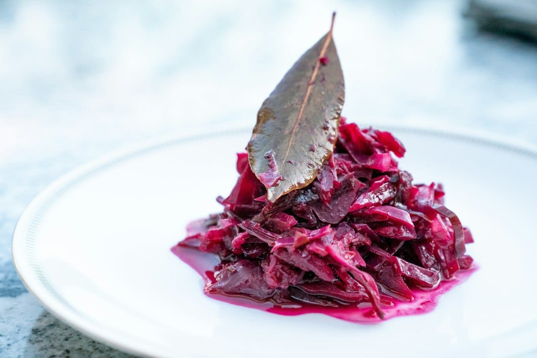Shredded red cabbage served in a small mound on a plate