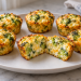 Cottage cheese broccoli egg cups without a blender, with one cut open to show the curds