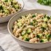 Two bowls of pearl barley, white beans, diced cucumber, and parsley with lemon-Dijon dressing.