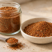 Homemade blackening seasoning recipe in a glass jar and ceramic bowl