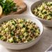 Two bowls of fine bulgur, whole brown-green lentils, diced cucumber, and chopped parsley with a light lemon dressing.