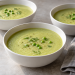 Smooth frozen cauliflower pea soup without heavy cream, finished with cooked peas, dill and black pepper