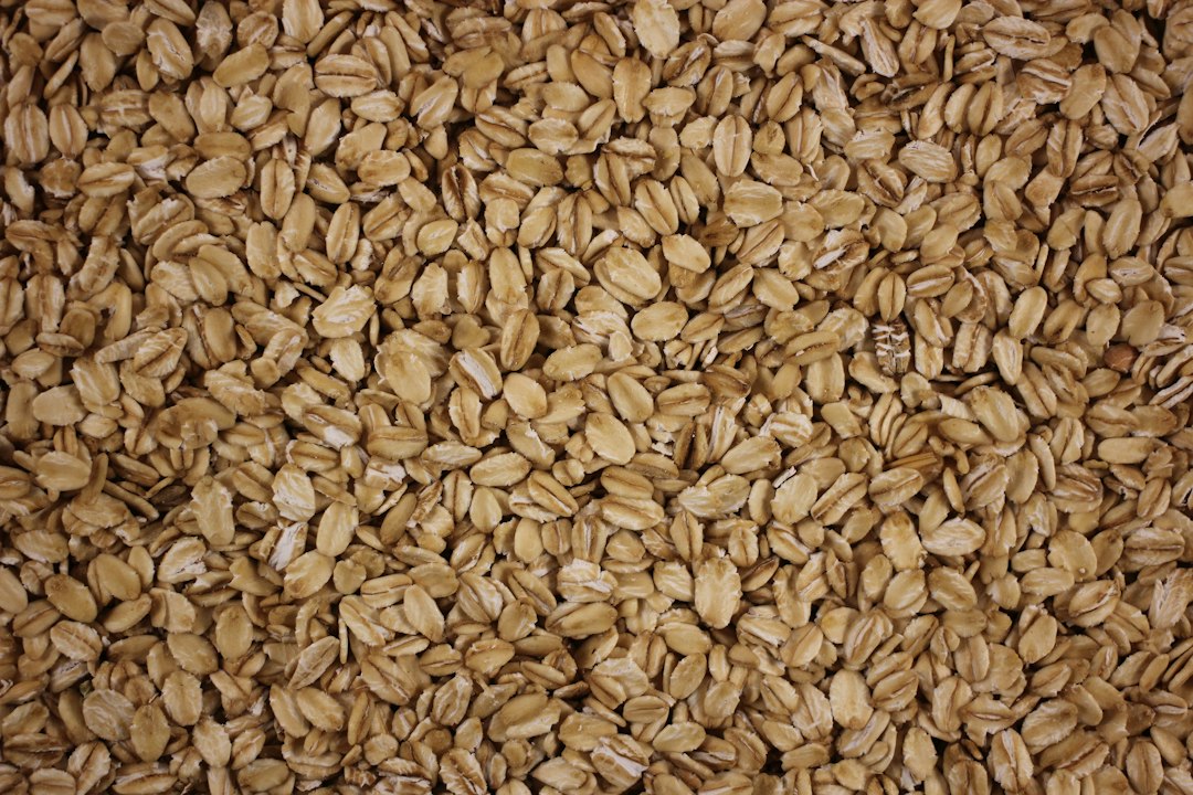 Oat flakes used as the base for savory oatmeal with frozen peas