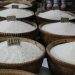 Baskets of white rice at a merchant stall in Hanoi