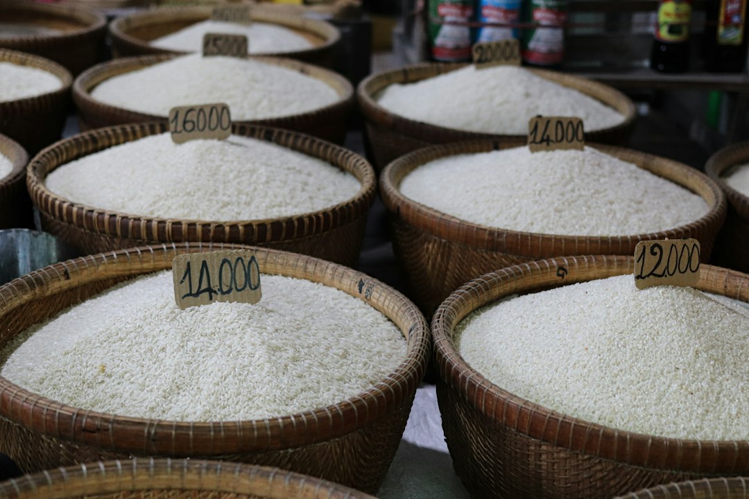 Baskets of white rice at a merchant stall in Hanoi