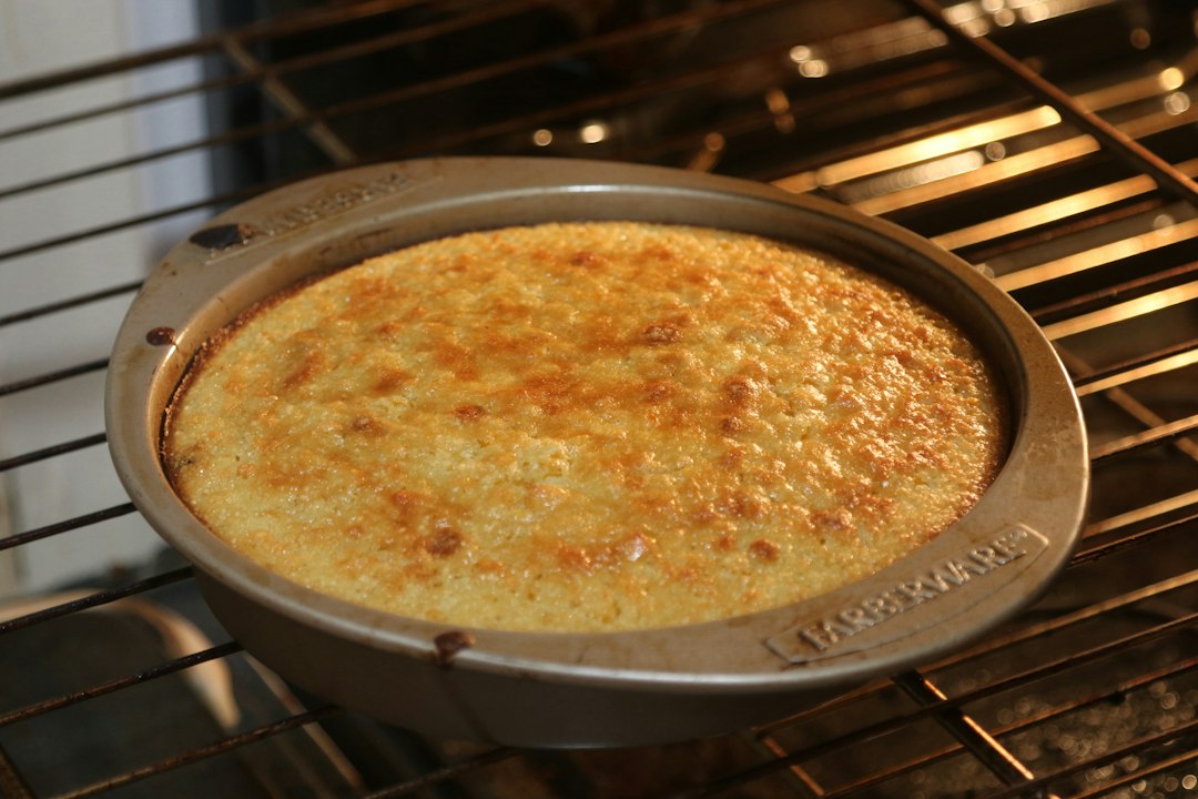 Golden cornbread baking in a round pan, a visual reference for small batch skillet cornbread without eggs