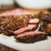 Sliced seared steak with a pink center, featured in the steak doneness temperature chart