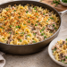 Creamy tuna noodle casserole in a skillet with toasted crumbs