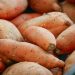 Whole sweet potatoes at a market, an ingredient reference for sweet potato black bean skillet without tomatoes