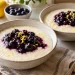 Two bowls of lemon blueberry farina with separate cooked blueberry topping