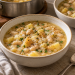 Chunky white bean and potato soup with parsley in two bowls